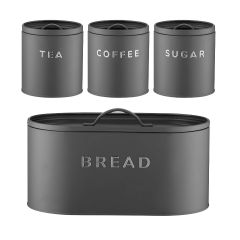 A set of four dark gray storage canisters labeled "Tea," "Coffee," "Sugar," and a larger "Bread" bin. Sleek, modern design with a minimalist feel.