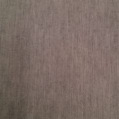 Close-up of light brown knitted fabric with a fine, uniform texture. The image highlights the soft, subtle weave and neutral tone.