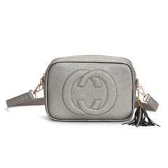 A black textured leather crossbody bag with a rounded rectangular shape. It features a prominent interlocking logo and a detachable strap with gold hardware.