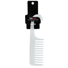 A frosted white detangling comb with wide teeth and a curved handle hangs on a black card labeled "haircare." The design is sleek and functional.