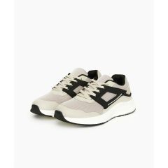 A pair of stone athletic sneakers with white soles, displayed on a white background. The design features a mesh upper and sleek, modern lines.