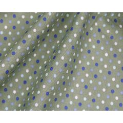Electric blue fabric with tiny navy, white, and lime dots draped in soft folds.