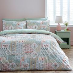 Catherine Lansfield folk patchwork reversible duvet cover set with pastel floral design