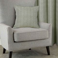 Showing the Arlo Green Cushion Cover on a chair