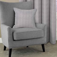 Showing the Arlo Taupe Cushion Cover on a chair