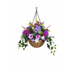Artificial hanging flower basket with purple pink white flowers and trailing ivy on white background