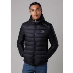 A person wearing a black puffer jacket with a small emblem on the chest, standing with hands in pockets, against a neutral background, exuding a casual and relaxed demeanor.