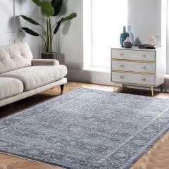 Vintage Blue Bordeaux distressed Persian style rug in blue and grey with an elegant faded floral pattern in living room