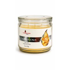 Frankincense and Myrrh scented candle in a glass jar with bright yellow wax