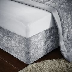 Corner detail of the Catherine Lansfield crushed velvet divan base wrap in silver, showing its soft textured finish.