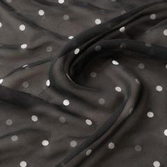 Sheer black chiffon with white and grey polka dots gathered into soft folds.
