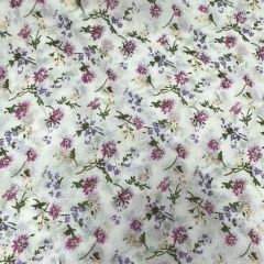 White chiffon fabric scattered with tiny purple and pink flowers and green leaves.