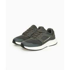 A pair of grey athletic sneakers with white soles, displayed on a white background. The design features a mesh upper and sleek, modern lines.