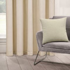 A minimalist room features Linen colour curtains, a soft gray chair, and a matching linen cushion. The mood is calming and elegant, with natural light.