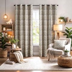 Cozy living room with chevron-patterned curtains framing a window, neutral armchair with cushion, plants, a wooden lamp, and candles, creating a warm, inviting atmosphere.