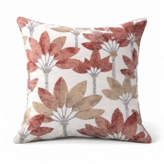 Square cushion with a white background featuring a floral pattern in red and beige. The design is symmetrical, creating a warm, inviting feel.