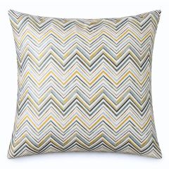 Square pillow with a bold chevron pattern in shades of yellow, green, and beige. The design is dynamic and modern, adding a vibrant touch.