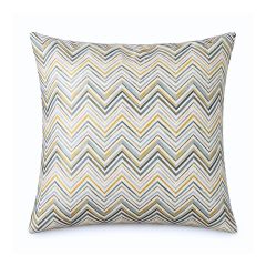 Square pillow with a bold chevron pattern in shades of yellow, green, and beige. The design is dynamic and modern, adding a vibrant touch.