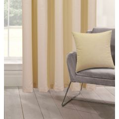 A cozy room with ivory curtains by a window, a gray chair with a matching ivory cushion. The scene is tranquil, with soft natural light filtering in.