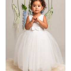 girl wearing white communion dress with tulle skirt and bow waist front view