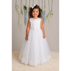 girl wearing white communion dress with lace hem and bow detail front view