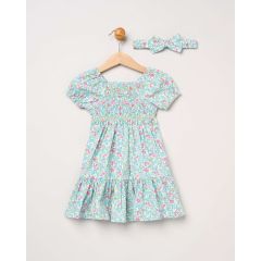 Baby girl blue floral cotton dress set with smocked detail and matching bow headband hanging on wooden hanger