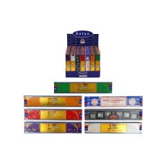 Display of assorted Satya incense sticks in a purple box, featuring diverse colorful packaging designs, including Nag Champa and Patchouli scents.