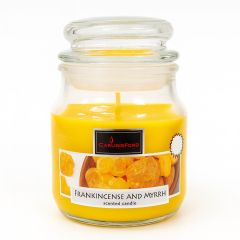 Frankincense and Myrrh scented candle in a glass jar with bright yellow wax