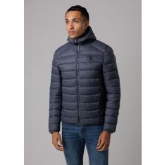 A man wearing a gray puffer jacket with a hood and blue jeans. The jacket has horizontal stitching and a logo on the chest. Neutral background.