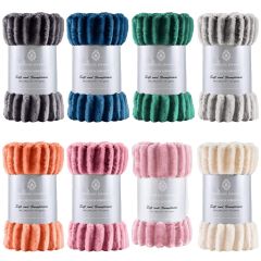 Image of 8 ribbed throws in various colours on a white background