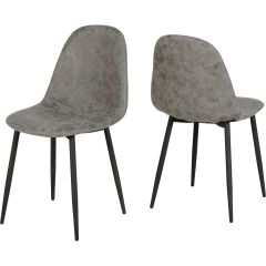Grey faux leather dining chairs with curved backs and black metal legs