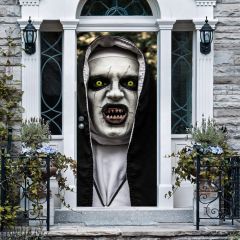 A front porch with stone walls and a white door fitted with the scary nun sticker. The sticker covers the door with a frightening nun’s face featuring glowing yellow eyes, cracked white skin, and jagged teeth.