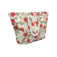 Floral tablecloth with bees, packaged on a cardboard hanger. It features images of plates and utensils, labeled "wipe clean with flannel backing."