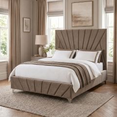 Luxury taupe upholstered bed frame with statement panelled headboard and matching footboard in a neutral bedroom.