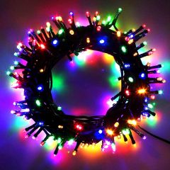 Top-down view of multicolour LED string lights coiled into a circular shape