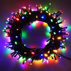 Coiled multicolour LED Christmas lights with vibrant red, green, blue, and yellow bulbs illuminated