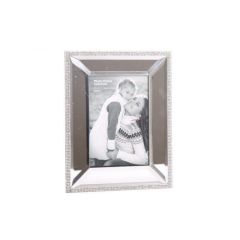 Silver photo frame with a black and white image of a woman holding a child, both smiling. The frame has a textured border.