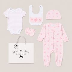 Pink butterfly baby 5 piece gift set including sleepsuit, bodysuit, bib, hat and mittens on neutral background