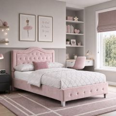 Pink upholstered bed frame with button-tufted headboard and footboard in a modern girls' bedroom.