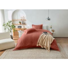 Rust tufted stripe duvet cover set styled in a bright, modern bedroom.