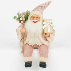 30cm Sitting Santa Claus in pink outfit holding a Christmas gift box, festive Christmas decoration