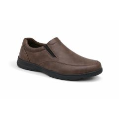 A blown leather slip-on shoe with a black low heel and a smooth, simple design. It features a rounded toe, elastic side panels, and appears comfortable and casual.