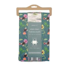 Floral tablecloth with bees, packaged on a cardboard hanger. It features images of plates and utensils, labeled "wipe clean with flannel backing."