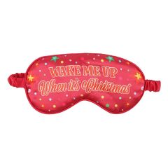Front view of red satin Christmas sleep mask with festive stars and “Wake Me Up When It’s Christmas” slogan.