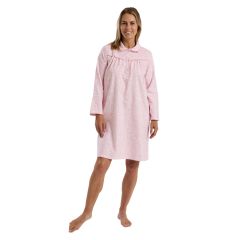 Woman wearing pink flannel nightdress, front view