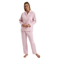Woman wearing pink cotton pyjama set, front view