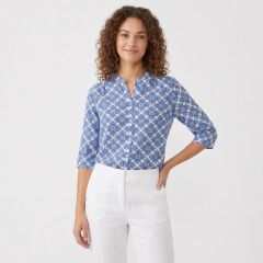 womens blue patterned cotton blouse with 3/4 sleeves and white trousers
